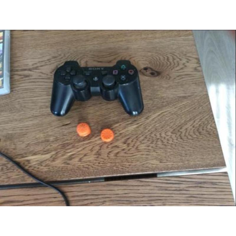 PS 3 inclusief controller en kontrolfreeks en 7 spellen